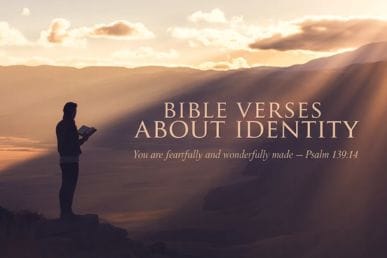 A cinematic devotional feature image showing a silhouetted figure holding an open Bible against a warm golden mountain landscape at dusk, with the text "Bible Verses About Identity" displayed in elegant serif typography, evoking biblical identity and Scripture.