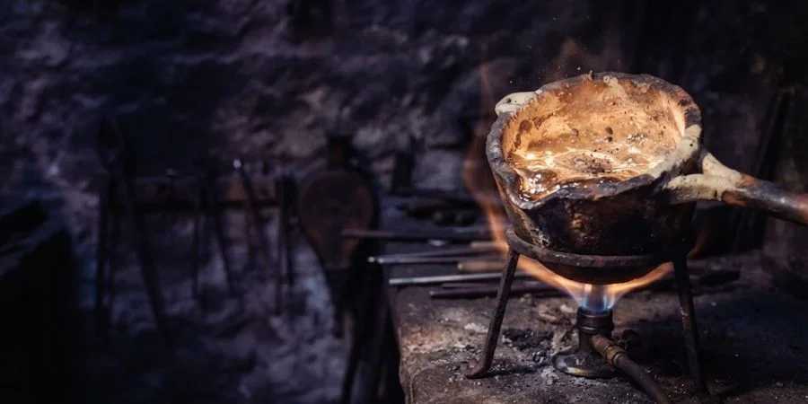 Molten silver refined by fire in a crucible, symbolizing Bible verses about resilience and hardship with purpose.